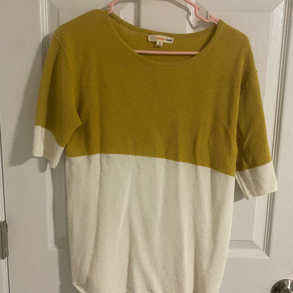Dressy too light weight sweater material. Mustard and white. Orange creek size m